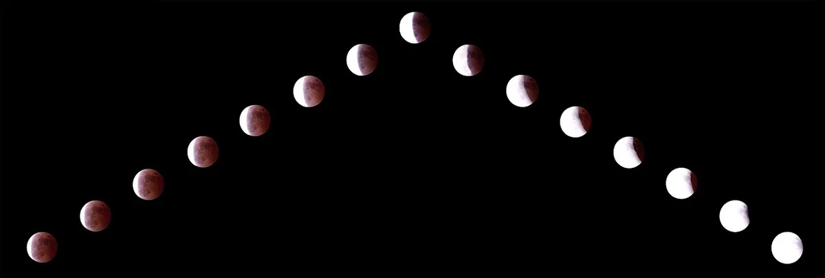 Lune partiellement éclipsée au-dessus d'un horizon flou